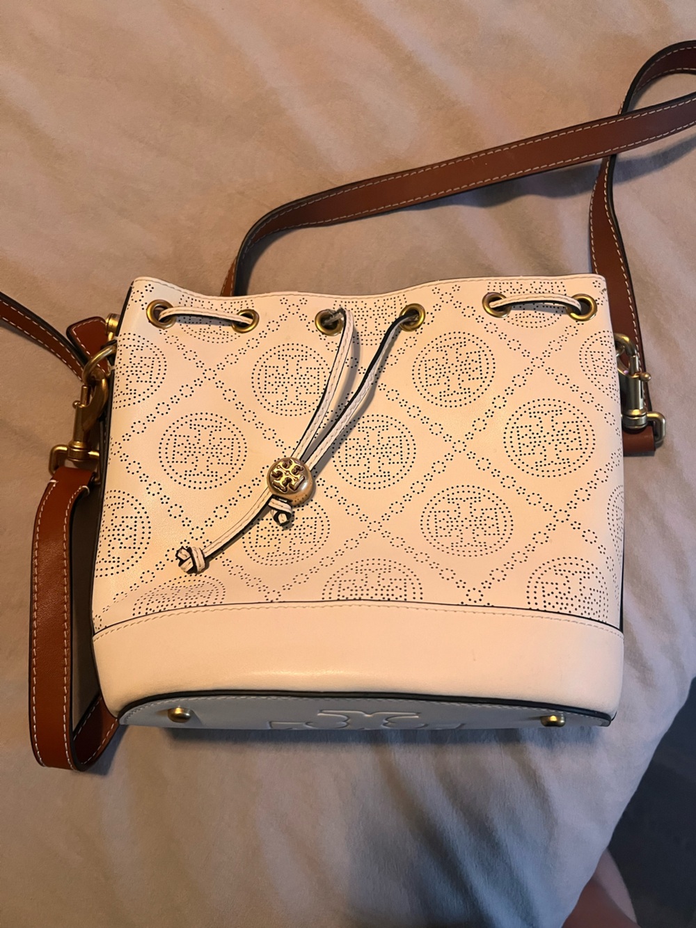 Tory Burch Cream Perforated Leather Drawstring Bucket Bag with Brown Strap